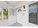 Exterior view of condo building entrance and hallway at 2430 Brazilia Dr # 24, Clearwater, FL 33763