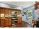Updated kitchen with stainless steel appliances and wood cabinets at 2430 Brazilia Dr # 24, Clearwater, FL 33763