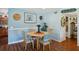 Charming dining room with wood table and blue chairs at 2430 Brazilia Dr # 24, Clearwater, FL 33763