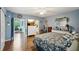 Spacious bedroom with a dresser and en-suite bathroom access at 2430 Brazilia Dr # 24, Clearwater, FL 33763