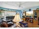 Relaxing living room featuring leather furniture and large TV at 2430 Brazilia Dr # 24, Clearwater, FL 33763