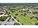 Aerial view of community with golf course and residential buildings at 2430 Brazilia Dr # 24, Clearwater, FL 33763