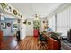 Bright home office features wood floors, built-in shelving, and a view into the kitchen at 2430 Brazilia Dr # 24, Clearwater, FL 33763