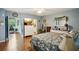 Spacious bedroom with king-size bed and access to sunroom at 2430 Brazilia Dr # 24, Clearwater, FL 33763