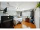 Bedroom with a king-size bed, wood floors, and a dresser at 2430 Brazilia Dr # 24, Clearwater, FL 33763