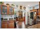 Kitchen boasts wood cabinets, granite countertops, and stainless steel appliances at 2430 Brazilia Dr # 24, Clearwater, FL 33763