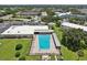 Refreshing community pool with plenty of surrounding lounge chairs at 2430 Brazilia Dr # 24, Clearwater, FL 33763