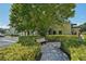 Relaxing community space with a shaded bench and landscaping at 2430 Brazilia Dr # 24, Clearwater, FL 33763