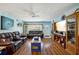 Living Room with leather furniture, wood floors and large screen TV at 2430 Brazilia Dr # 24, Clearwater, FL 33763