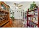 Sunroom boasts wood floors, built-in shelving, and a dog pen at 2430 Brazilia Dr # 24, Clearwater, FL 33763