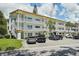 Two-story building with parking and lush landscaping at 2430 Brazilia Dr # 24, Clearwater, FL 33763