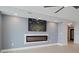 Living room with fireplace, and ceiling fan at 50 Coe Rd # 125, Belleair, FL 33756