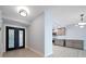 Bright entryway with modern double doors and kitchen view at 50 Coe Rd # 125, Belleair, FL 33756