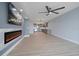 Open concept living area with kitchen and fireplace at 50 Coe Rd # 125, Belleair, FL 33756