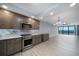 Open concept kitchen and living area with water views at 50 Coe Rd # 125, Belleair, FL 33756