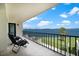 Balcony with patio furniture overlooking a scenic waterfront view at 50 Coe Rd # 125, Belleair, FL 33756
