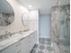 Modern bathroom with double vanity and glass shower at 50 Coe Rd # 125, Belleair, FL 33756