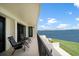 Spacious balcony overlooking scenic waterfront views, complete with comfortable seating at 50 Coe Rd # 125, Belleair, FL 33756