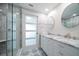 Updated bathroom with double vanity, marble counters, and patterned tile floor at 50 Coe Rd # 125, Belleair, FL 33756