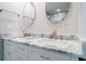 Double vanity bathroom with marble countertop, modern faucets, and stylish mirrors at 50 Coe Rd # 125, Belleair, FL 33756