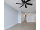 Spacious bedroom with ceiling fan and double doors to closets at 50 Coe Rd # 125, Belleair, FL 33756