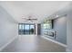Bright living room with water view, fireplace, and hardwood floors at 50 Coe Rd # 125, Belleair, FL 33756