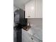 Convenient laundry area with stackable washer and dryer, and additional storage at 50 Coe Rd # 125, Belleair, FL 33756