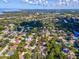 Wide aerial view showcasing home and surrounding waterfront area at 3047 Enisglen Dr, Palm Harbor, FL 34683