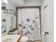 Clean bathroom with floral shower curtain and updated vanity at 3047 Enisglen Dr, Palm Harbor, FL 34683