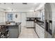 Modern kitchen with stainless steel appliances and granite countertops at 3047 Enisglen Dr, Palm Harbor, FL 34683