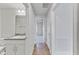 Hallway with tile flooring and access to bedrooms and bathroom at 105 Dartmouth Rd, Venice, FL 34293
