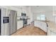 Modern kitchen with stainless steel appliances and granite countertops at 105 Dartmouth Rd, Venice, FL 34293