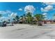 Parking lot with tropical landscaping near a waterfront restaurant at 105 Dartmouth Rd, Venice, FL 34293