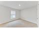 Bright bedroom with neutral walls and carpeted floor at 105 Dartmouth Rd, Venice, FL 34293