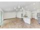 Open living and kitchen area with vaulted ceilings at 105 Dartmouth Rd, Venice, FL 34293