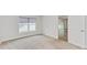 Bedroom with carpeted floor and access to living area at 105 Dartmouth Rd, Venice, FL 34293