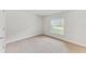 Well-lit bedroom featuring a large window and closet at 105 Dartmouth Rd, Venice, FL 34293