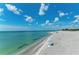 Scenic beach view with calm water, and blue sky with puffy clouds at 105 Dartmouth Rd, Venice, FL 34293