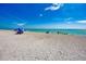 Relaxing beach scene with people enjoying the sun and water at 105 Dartmouth Rd, Venice, FL 34293