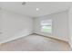 Bright bedroom with neutral walls and carpeted floor at 105 Dartmouth Rd, Venice, FL 34293