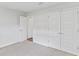 Bright bedroom with ample closet space and neutral carpeting at 105 Dartmouth Rd, Venice, FL 34293