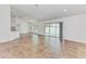 Open living area with tile floors and access to the patio at 105 Dartmouth Rd, Venice, FL 34293