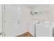 Laundry room with washer, dryer, and extra shelving at 105 Dartmouth Rd, Venice, FL 34293