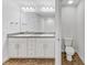 Bathroom with double vanity, toilet and tile flooring at 105 Dartmouth Rd, Venice, FL 34293