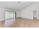 Spacious living room with sliding glass doors leading to the backyard at 105 Dartmouth Rd, Venice, FL 34293