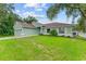 Charming house exterior with a well-maintained lawn at 105 Dartmouth Rd, Venice, FL 34293