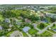 Aerial view of a neighborhood, showing houses, roads, and green spaces at 105 Dartmouth Rd, Venice, FL 34293
