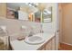 Bathroom with white tile, a single sink, and mirrored medicine cabinet at 6220 5Th S Ave, St Petersburg, FL 33707