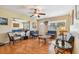 Living room boasts hardwood floors, comfy seating, and a ceiling fan, creating a cozy atmosphere at 6220 5Th S Ave, St Petersburg, FL 33707