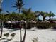 Outdoor seating area of beachfront restaurant with palm trees at 6220 5Th S Ave, St Petersburg, FL 33707